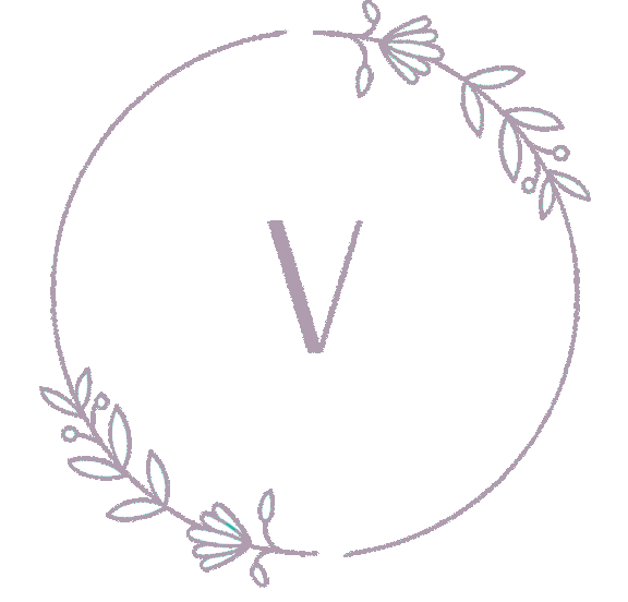 A circular logo featuring a stylized letter "V" surrounded by delicate floral elements
